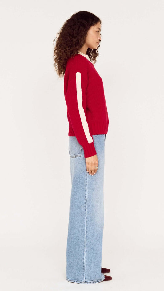 Relaxed Red Contrast Stripe Jumper featuring a bold red color with white stripe details, styled with high-waisted jeans.