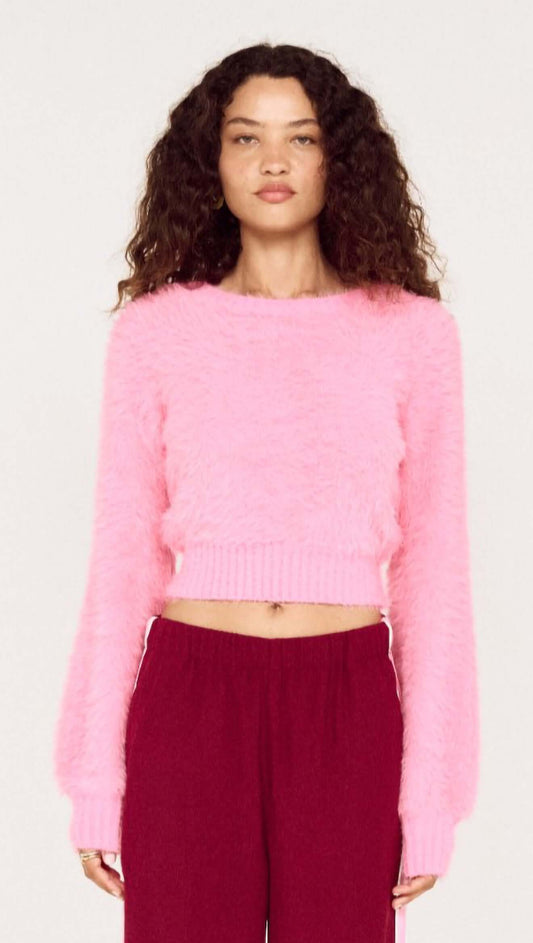 Clio Cropped Fuchsia Pink Fluffy Jumper worn by model with curly hair, showcasing a vibrant, soft knit texture.