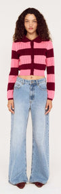 Model wearing a Pink Stripe Pointelle Knit Cardi paired with wide-leg jeans on a neutral background.