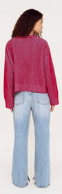 Model wearing a Blue and Berry Contrast Rib Knit Jumper from the back, paired with light blue jeans.