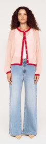 Sheer Contrast Trim Pink Cardigan worn with wide-leg jeans, showcasing a stylish, playful knitwear look.