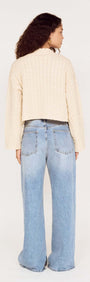 Fine Cable Knit Top with Gold Detail worn with relaxed denim from a rear view.