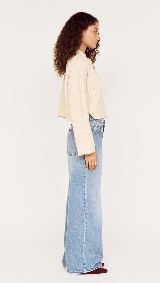 Model wearing a Fine Cable Knit Top with Gold Detail styled with relaxed denim for a modern look.