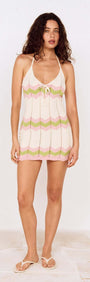 Pointelle Green Stripe Mini Dress worn by a model, featuring a halter neck and playful stripe pattern.