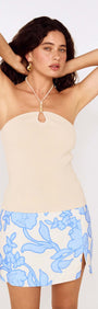 Cream Bead Detail Knitted Halter Top worn by model with floral skirt and hands in hair.