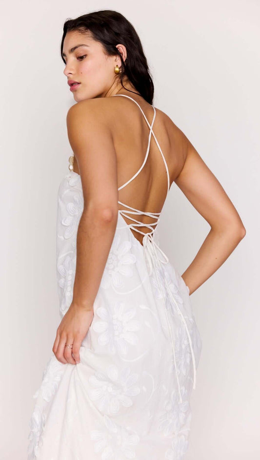 White Cotton Floral Applique Lace-Back Maxi Dress featuring a stunning lace-up back and floral details.