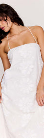 White Cotton Floral Applique Lace-Back Maxi Dress featuring delicate floral details and a stunning silhouette.
