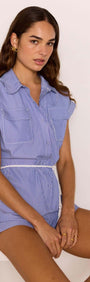 Blue & White Stripe Playsuit worn by a model, featuring a relaxed fit and button-down front.