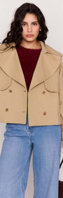 Beige Cotton Drill Cropped Trench featuring wide lapels and double-breasted front, styled with jeans.