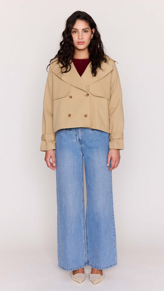 Beige Cotton Drill Cropped Trench styled with wide-leg denim and heels, showcasing a modern, structured design.