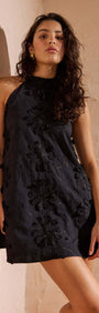 Black Cotton Applique High Neck Mini Dress in black with floral applique detail on a model.