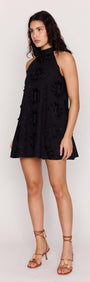 Black Cotton Applique High Neck Mini Dress worn by model, showcasing floral details and halter-style design.