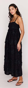 Black Tiered Cotton Applique Midi Dress featuring a fitted bodice and flowing skirt, designed for elegance.