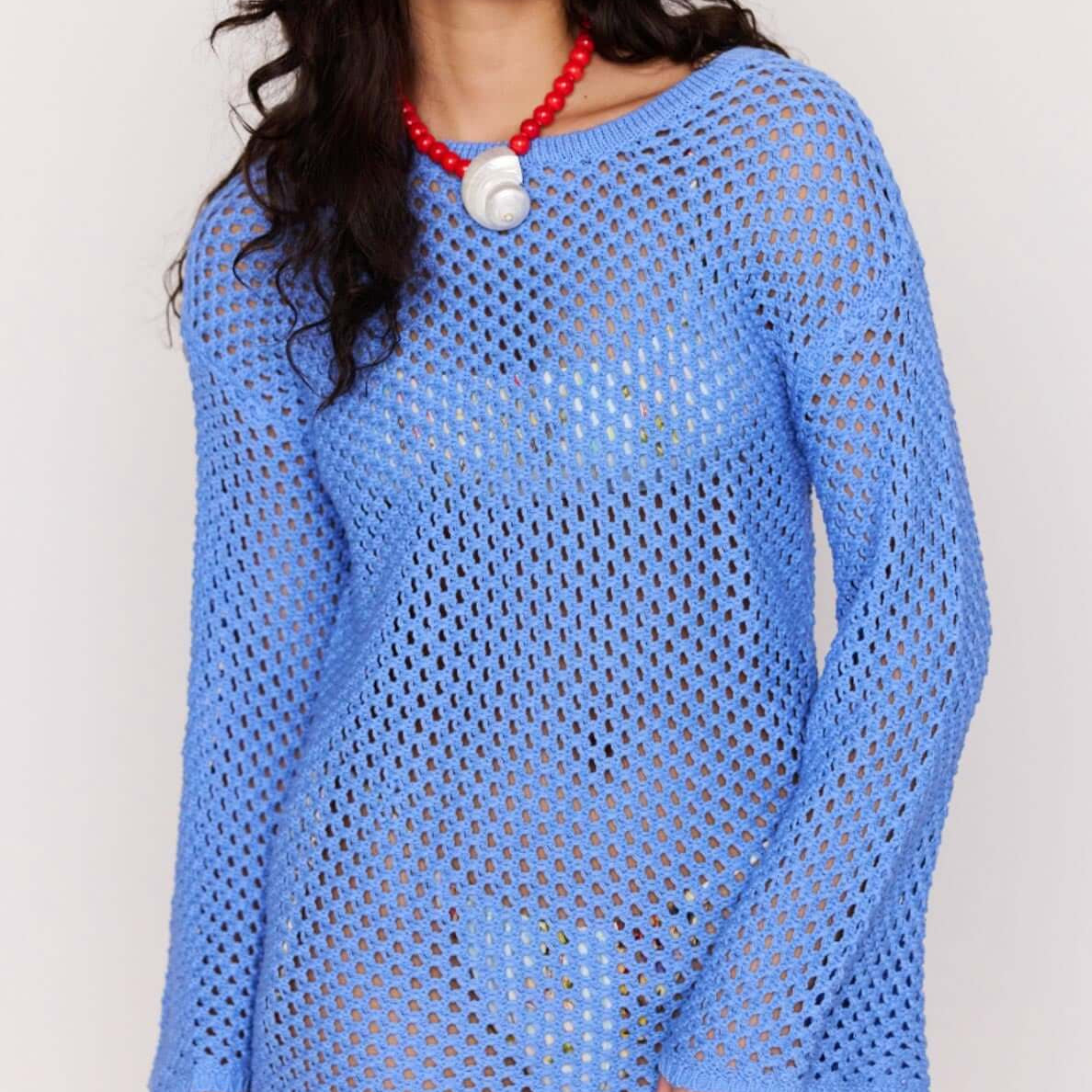 Blue Cotton Crochet Knit Mini Dress worn by a model, showcasing its open-knit design and relaxed silhouette.