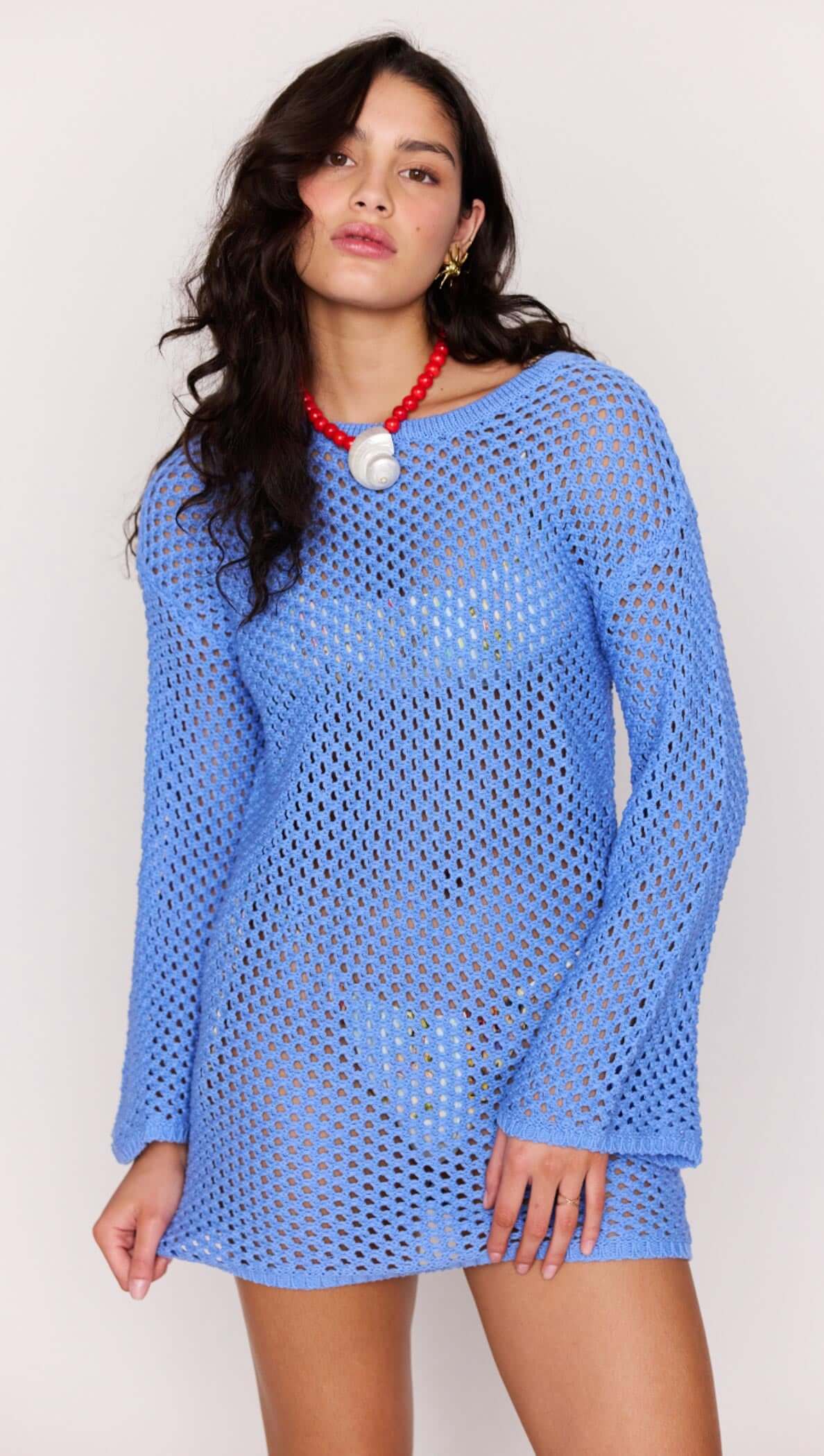 Blue Cotton Crochet Knit Mini Dress worn by a model, showcasing its open-knit design and relaxed silhouette.