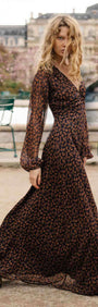 Brown Floral Drape Sleeve Maxi Dress modeled outdoors with a flowing silhouette and drape sleeves.