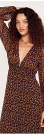 Brown Floral Drape Sleeve Maxi Dress featuring a deep V-neck and flowy sleeves.