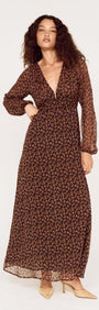 Model wearing a Brown Floral Drape Sleeve Maxi Dress, showcasing elegant design and floral patterns.