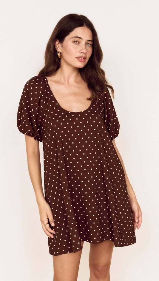 Brown Linen Blend Polka Dot Puff Sleeve Mini Dress worn by a model, featuring puff sleeves and a scoop neckline.