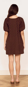 Back view of the Brown Linen Blend Polka Dot Puff Sleeve Mini Dress showcasing its playful design.