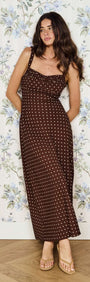 Model wearing Brown Linen Blend Polka Dot Square Neck Midi Dress against floral wallpaper background.