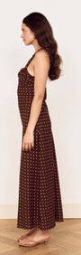 Brown Linen Blend Polka Dot Square Neck Midi Dress worn by a model showcasing its flattering silhouette and design.