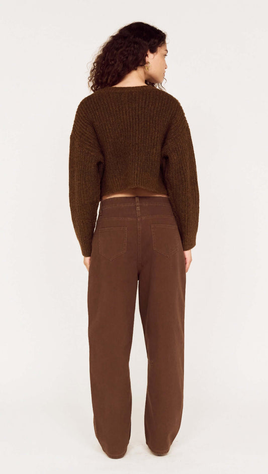Back view of a model wearing a Brown Cropped Cardigan with Gold Button Detail, styled with matching brown pants.