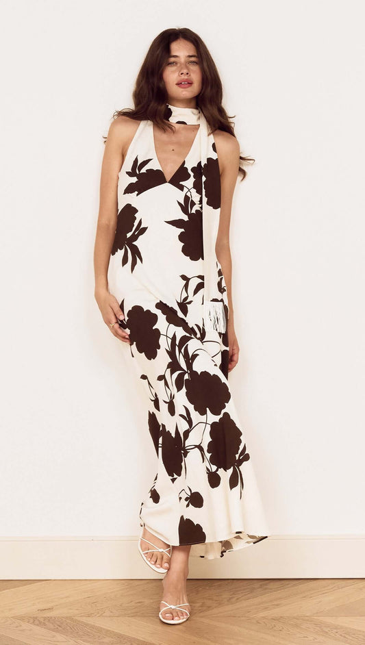 Brown and Cream Floral Halter Neck Maxi Dress on a model with a fringed neck scarf and oversized floral print.
