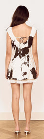 Back view of the Elodie Brown and Cream Floral Layered Mini Dress showcasing the open back and floral design.
