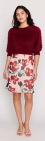 Model wearing a Burgundy Cropped Fluffy Knit Sweater styled with a floral skirt.