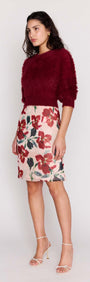 Model showcasing Burgundy Cropped Fluffy Knit Sweater paired with a floral skirt for a stylish look.