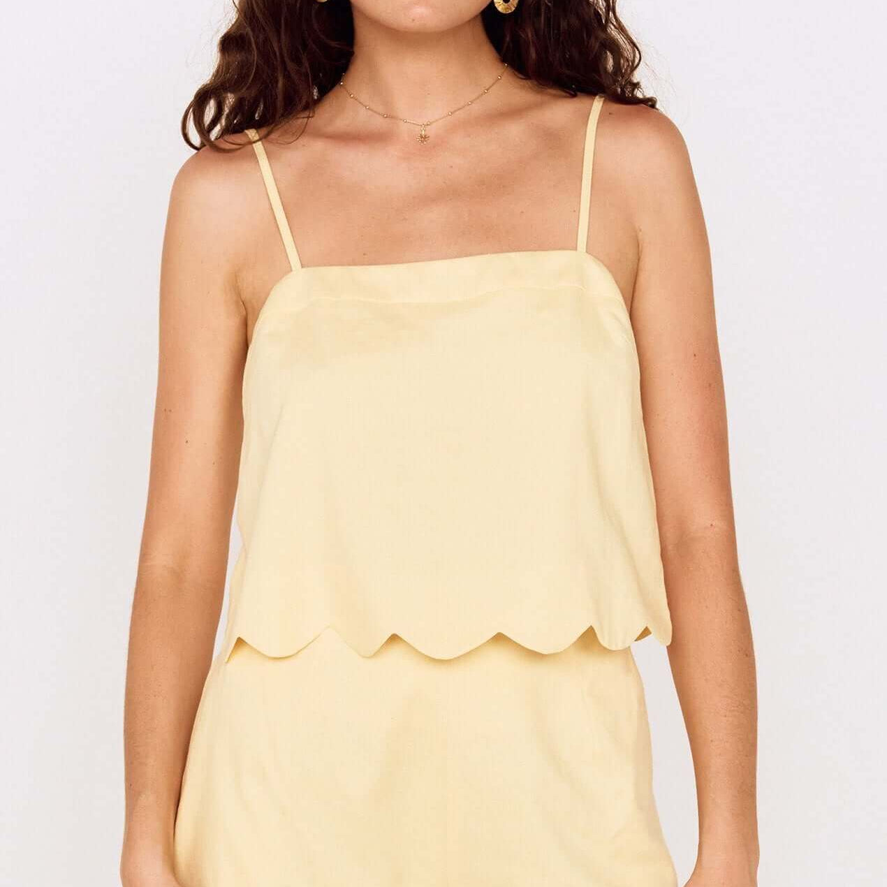 Butter Yellow Cotton Blend Scallop Hem Shorts worn with matching scalloped top on a model.