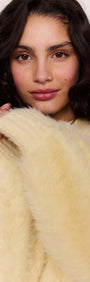Model wearing a Butter Yellow Fluffy Knit Jumper with long sleeves and a soft, fluffy texture.