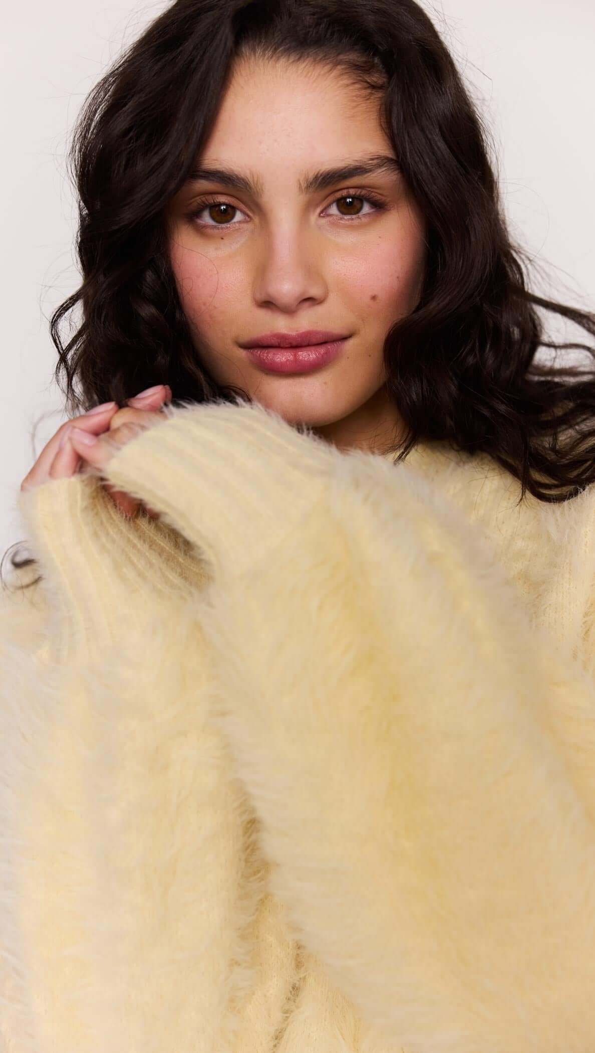Model wearing a Butter Yellow Fluffy Knit Jumper with long sleeves and a soft, fluffy texture.