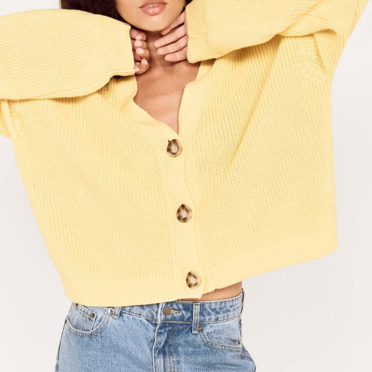 Butter Yellow Oversized Cardigan with Volume Sleeve worn by model, featuring button details and relaxed fit.