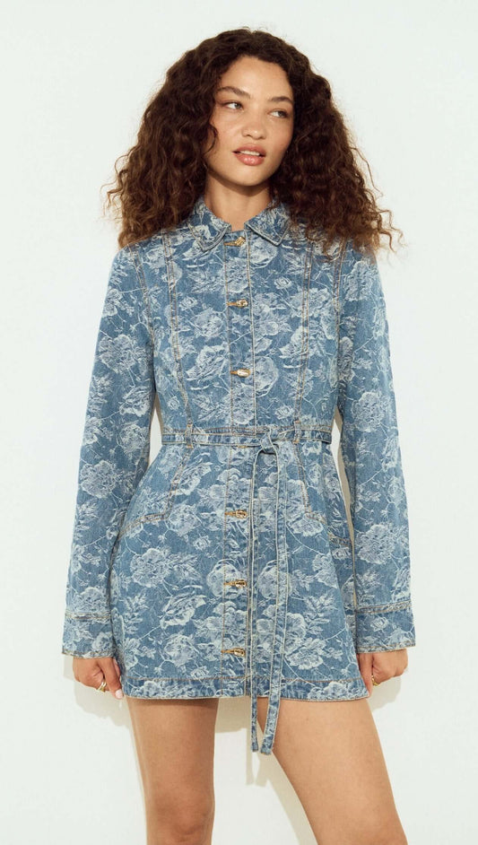 Button Through Floral Denim Dress with Tie Waist worn by model, featuring a floral print and button closure.