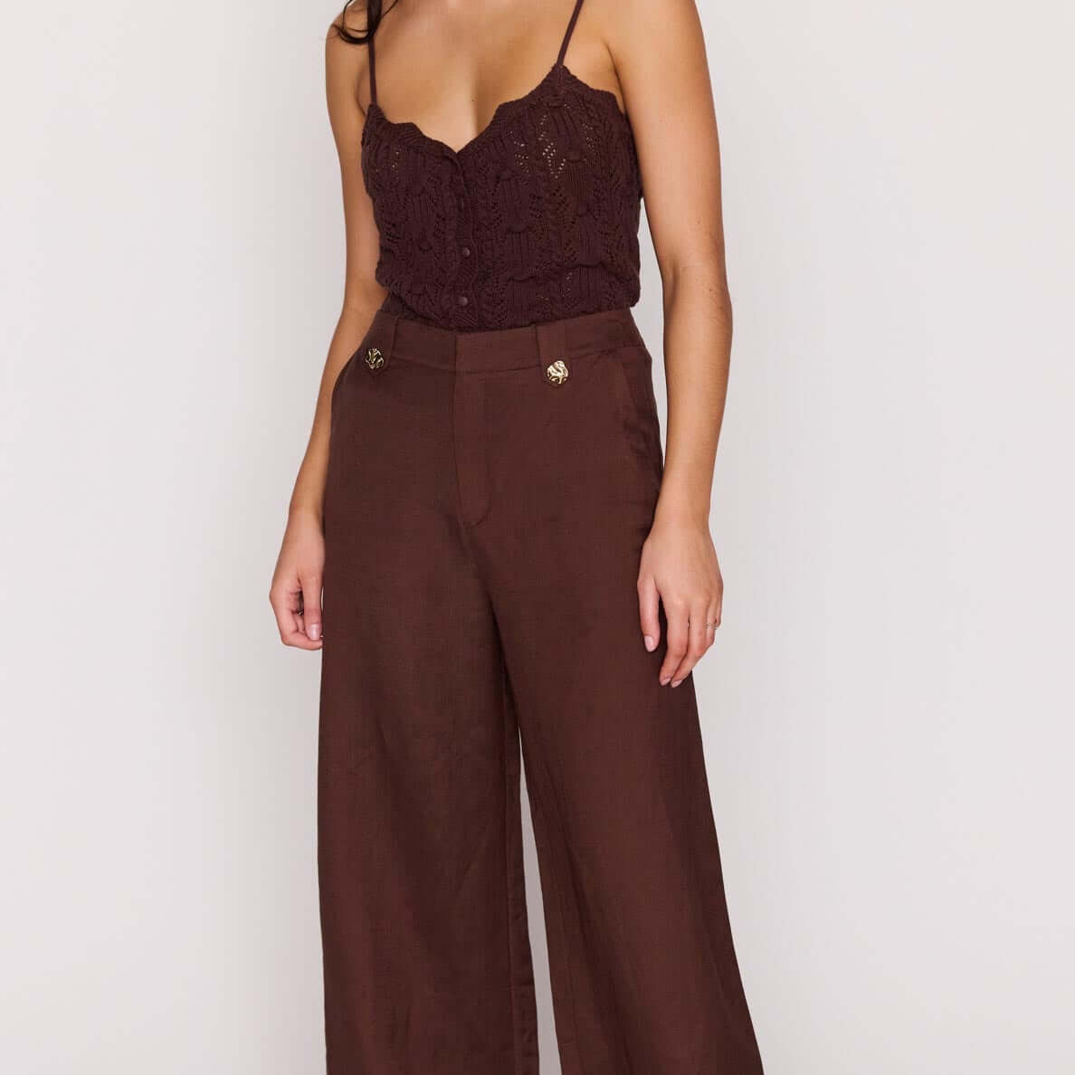 Model wearing Chocolate Brown Linen Blend Wide-Leg Pants with a lace top, showcasing a breezy summer outfit.
