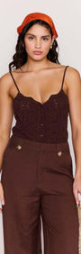 Model wearing Chocolate Brown Linen Blend Wide-Leg Pants with a knitted top and orange headband.