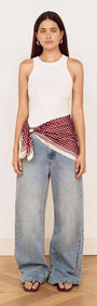 Model wearing Chocolate Polka Dot Scarf styled as a waist scarf with casual outfit.