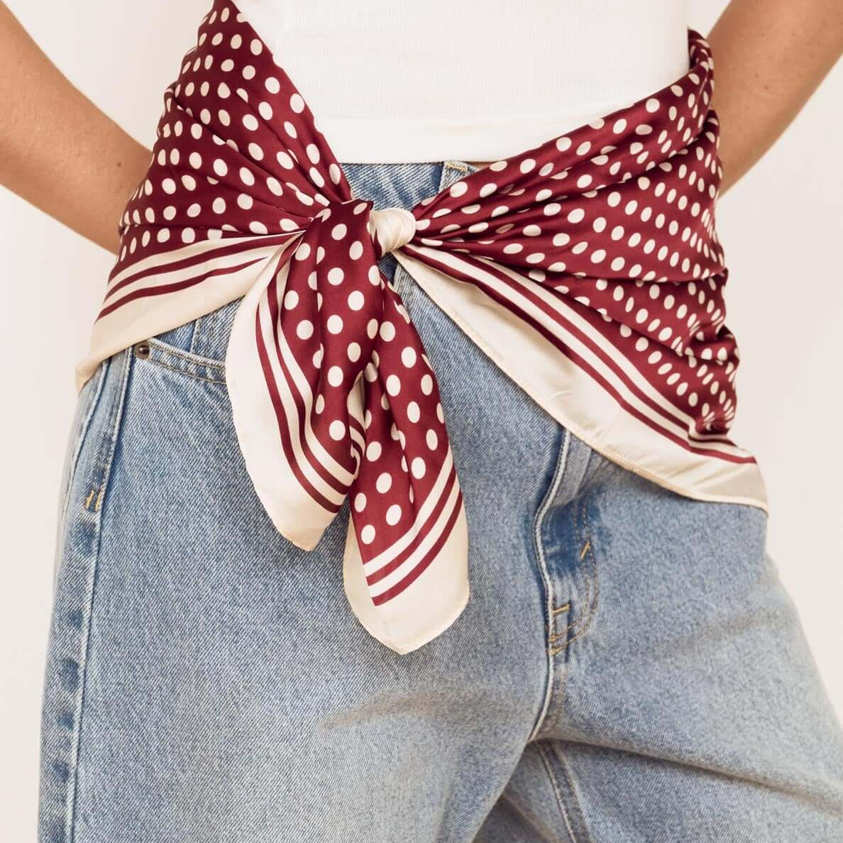 Chocolate Polka Dot Scarf styled as a waist wrap with denim, showcasing rich chocolate and classic polka dot pattern.