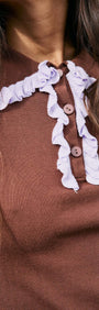 Chocolate Ruffle Collar Polo Knit Top featuring a playful ruffle collar and soft stretch knit, perfect for stylish outfits.