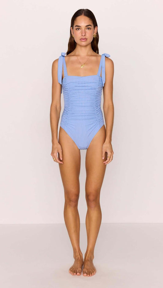 Model wearing a Blue Ruched One Piece Swimsuit with self-tie shoulder straps in cornflower blue