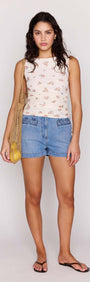 Model wearing Cream Floral Boat Neck Mesh Top with denim shorts and a net bag, showcasing everyday casual style.