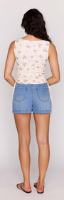 Cream Floral Boat Neck Mesh Top styled with denim shorts, showcasing the back view and adjustable side drawstrings.