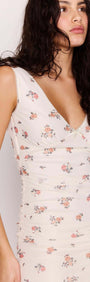 Cream Floral Ruffled Asymmetrical Mesh Mini Dress shown on model with floral print and deep V-neckline.