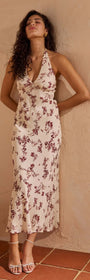 Model wearing Cream Floral Toile Halter Maxi Dress, featuring delicate floral print and plunging neckline.