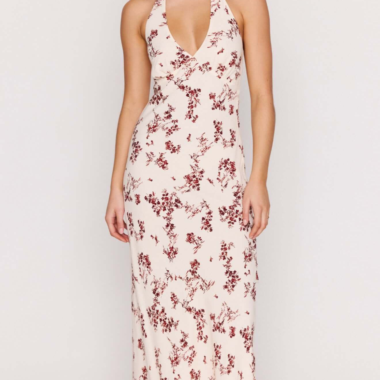 Cream Floral Toile Halter Maxi Dress featuring a plunging neckline and delicate floral print on soft fabric.