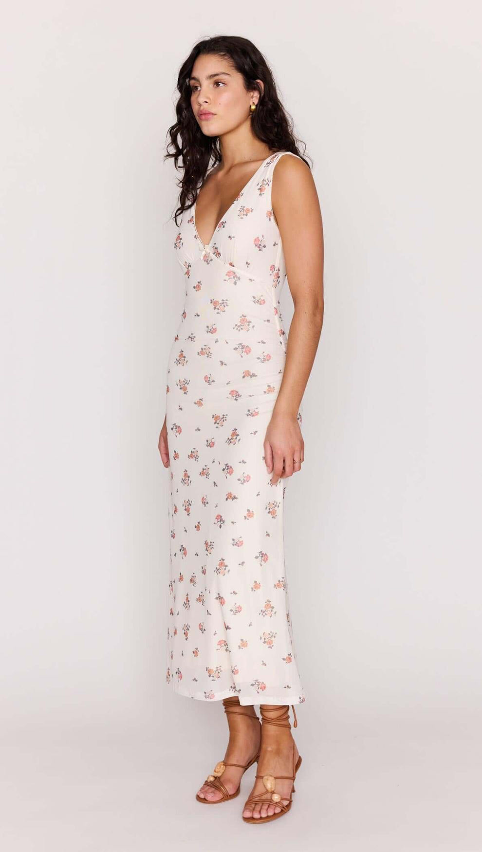 Cream Floral V-Neck Mesh Midi Dress displayed on a model, showcasing its flattering silhouette and floral design.