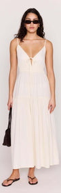 Cream Tie Front Tiered Maxi Dress worn by model, showcasing a flattering V-neckline and stylish tie-front detail.
