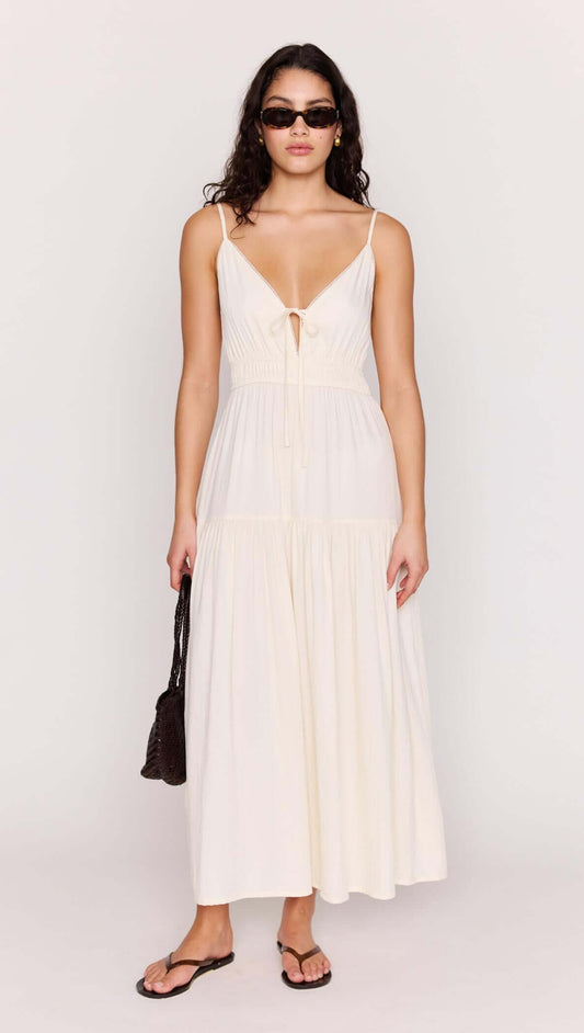 Cream Tie Front Tiered Maxi Dress worn by model, showcasing a flattering V-neckline and stylish tie-front detail.